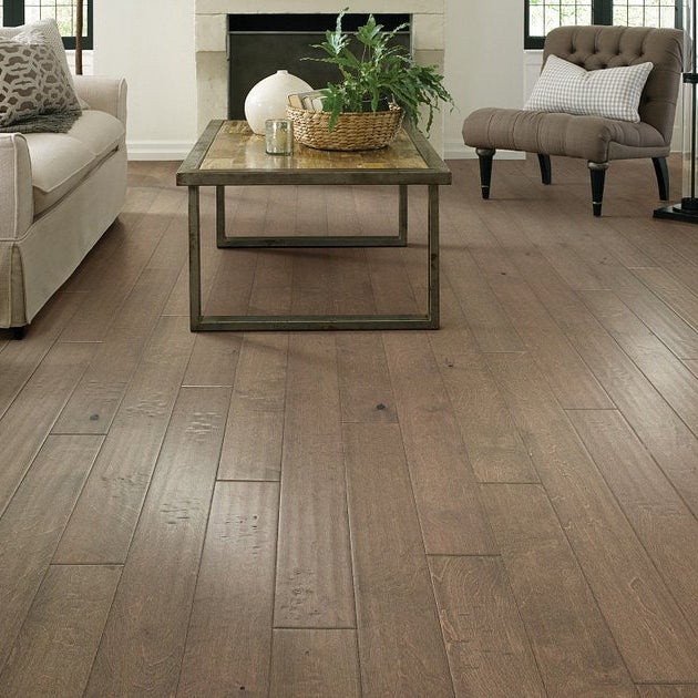 Living room view of Shaw Biscayne Bay Crescent Beach engineered hardwood flooring, showing natural wood hardwood color near the furniture layout.