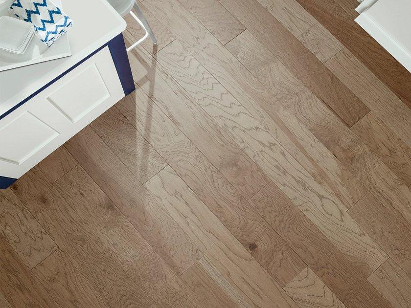 Shaw Northington Smooth Burlap engineered hardwood flooring photographed in a living room, pairing brown hardwood with the furniture layout.