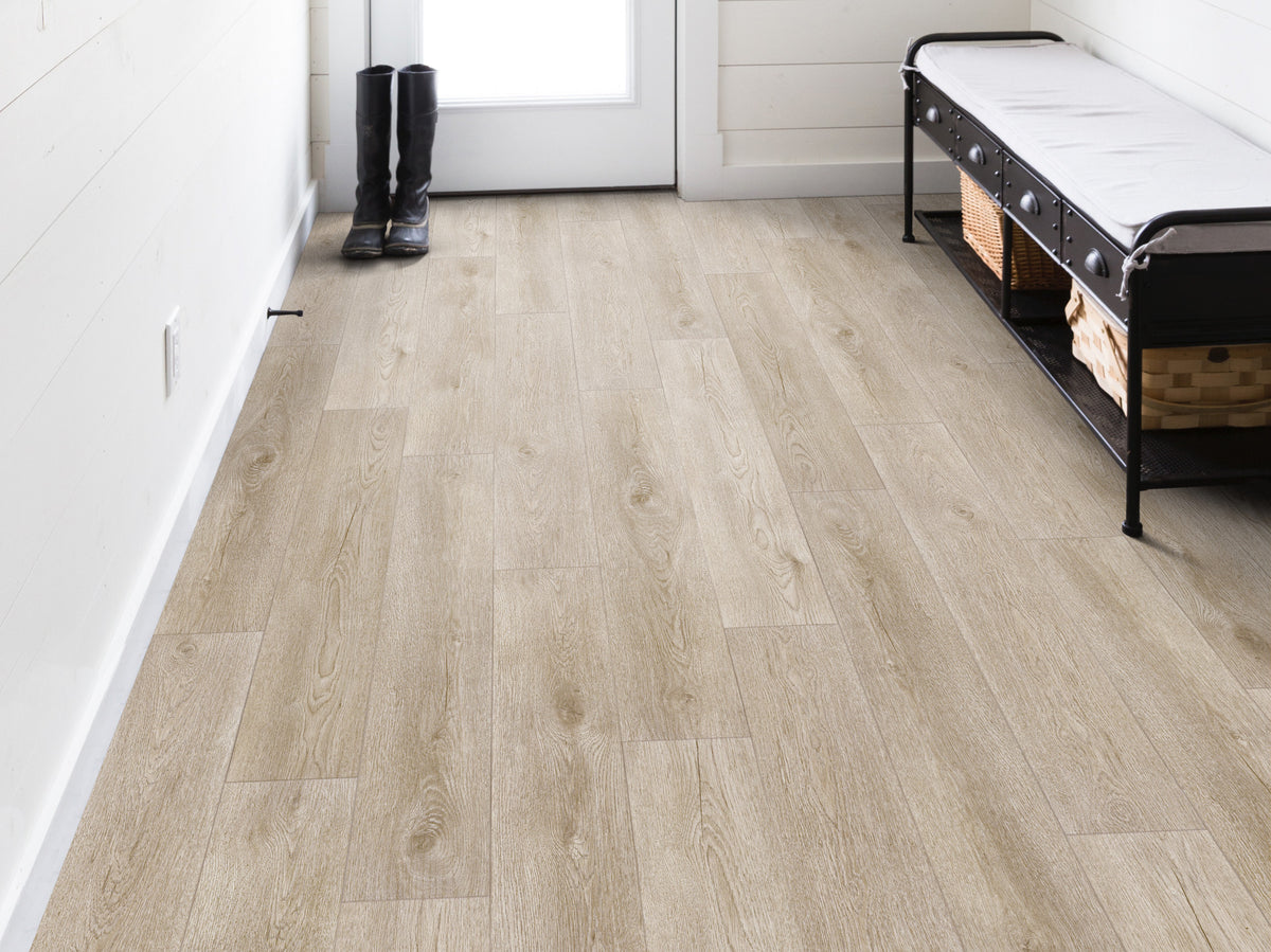 Inside a farmhouse-style entry, Shaw Paladin Plus Soft Beige (0278V-02094) runs past boots and a cushioned metal bench with baskets underneath, keeping the sandy beige floor in view. Make Soft Beige's room view part of a conversation with Floor City.