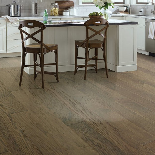 Living room view of Shaw High Plains 6 3/8 Nomadic engineered hardwood flooring, showing natural wood hardwood color near the furniture layout.