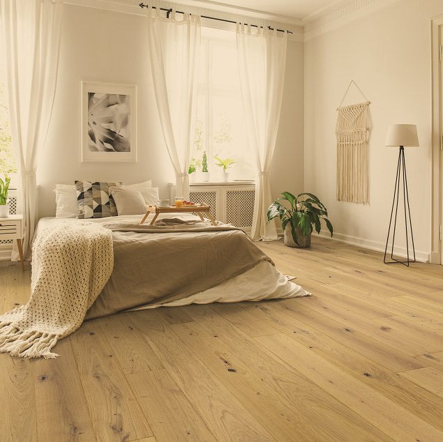 Living room room view with Shaw Expressions 9.5 Harmony engineered hardwood flooring in a natural wood hardwood finish.