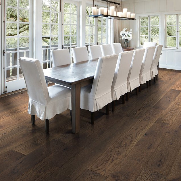 Living room view of Shaw Expressions 9.5 Bravura engineered hardwood flooring, showing natural wood hardwood color near sofa seating and the open floor area.