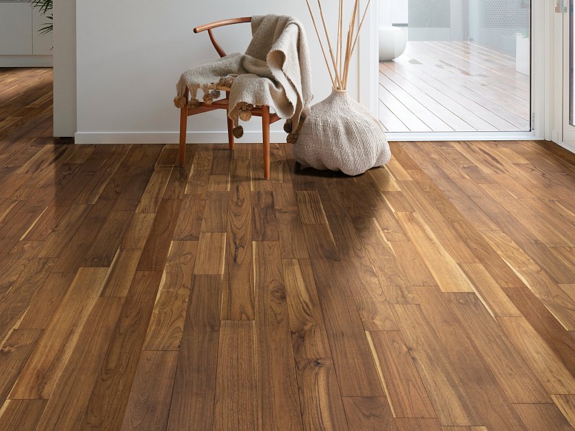 Living room view of Shaw Regatta Teak 5 Maritime engineered hardwood flooring, showing natural wood hardwood color near sofa seating and the open floor area.