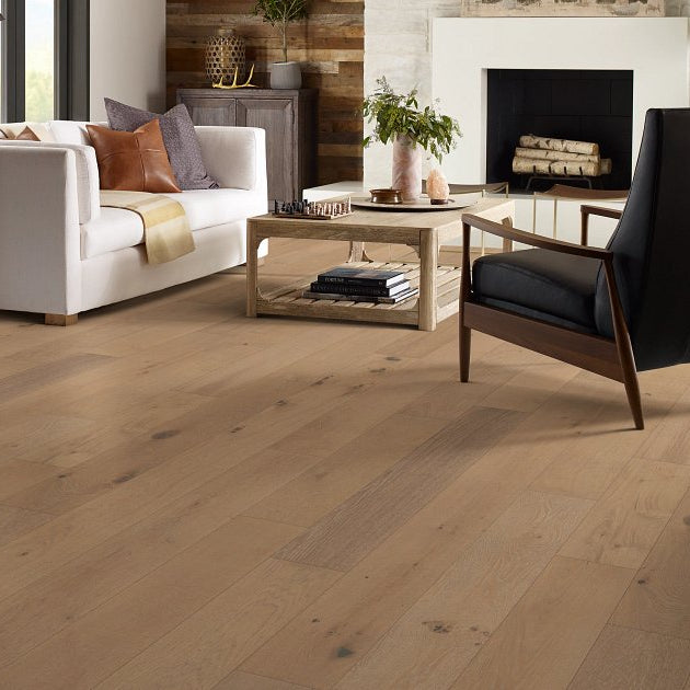Shaw Ensemble Brioche engineered hardwood flooring shapes this living room with natural wood color around the furniture layout.