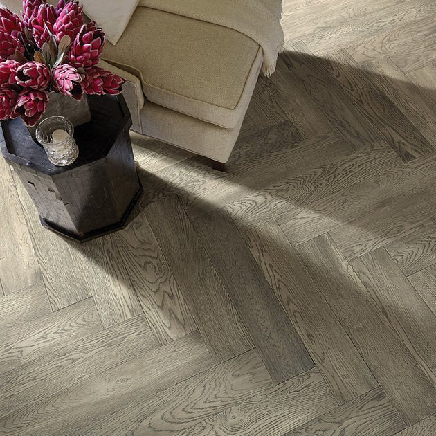 Shaw Fifth Avenue Oak Roosevelt engineered hardwood flooring in a living room, where natural wood wood tones sit naturally with sofa seating and the open floor area.