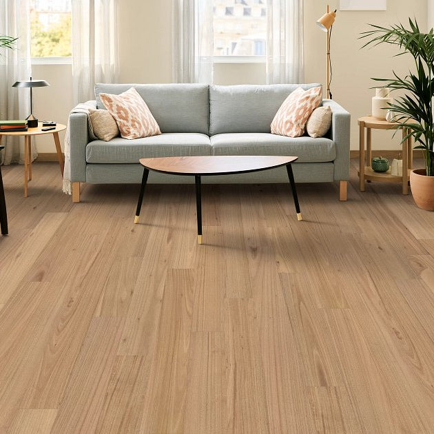 Shaw Bridgewater Eucalyptus Coral Sand engineered hardwood flooring shown across a living room, highlighting a natural wood hardwood look.