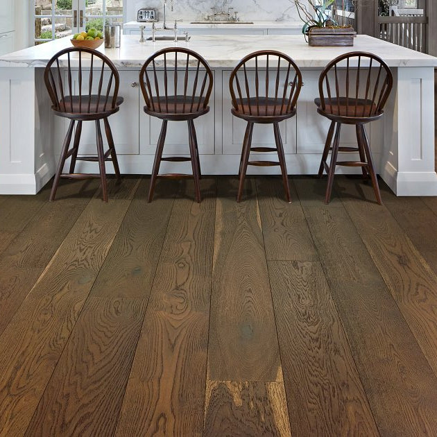 Shaw Expressions Muse engineered hardwood flooring gives this living room a polished look, with natural wood color around sofa seating and the open floor area.