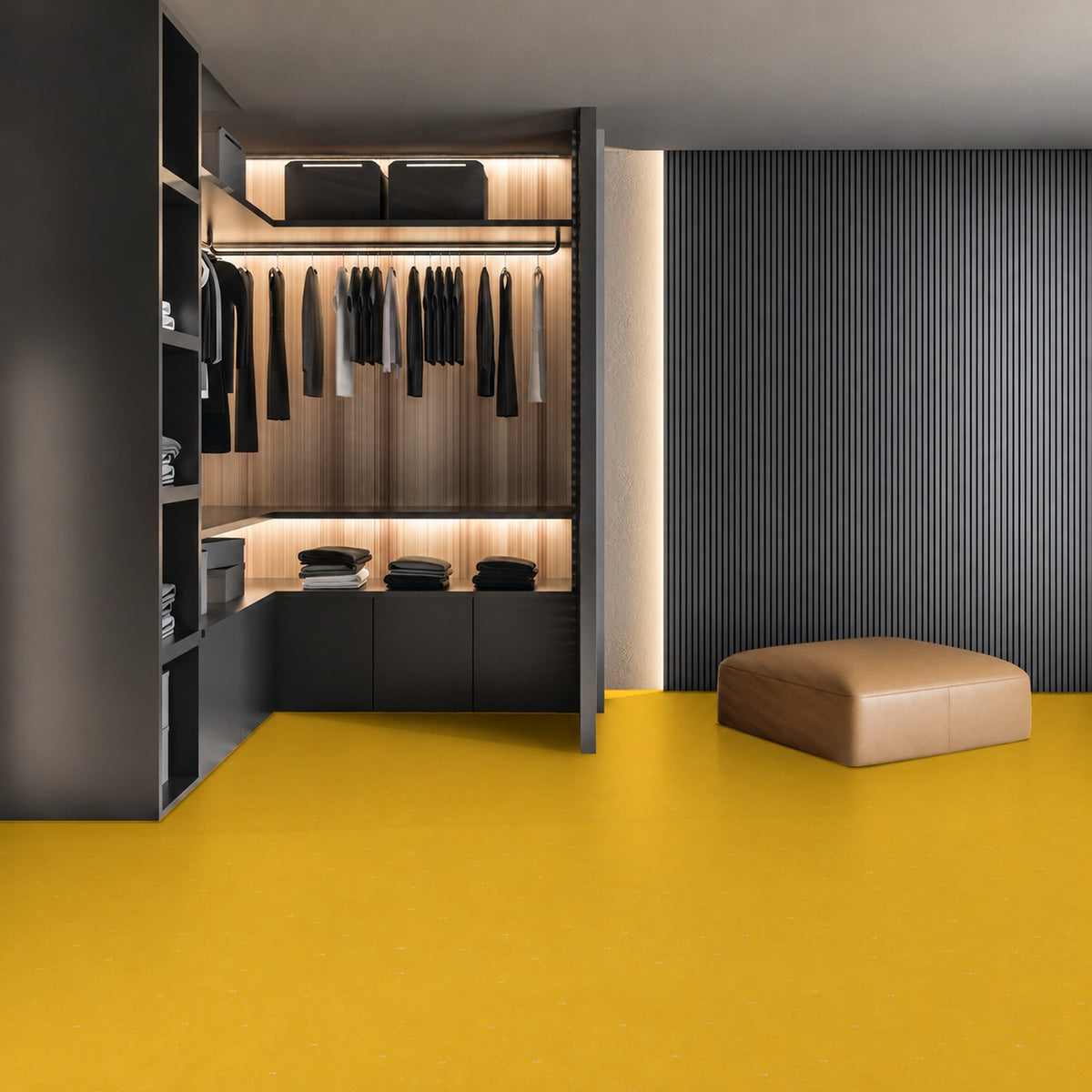 Armstrong Medintone Lemon Balm sheet vinyl, a bright golden yellow with faint light flecks, in a walk-in closet with dark shelving, lit hanging rails and a leather ottoman.