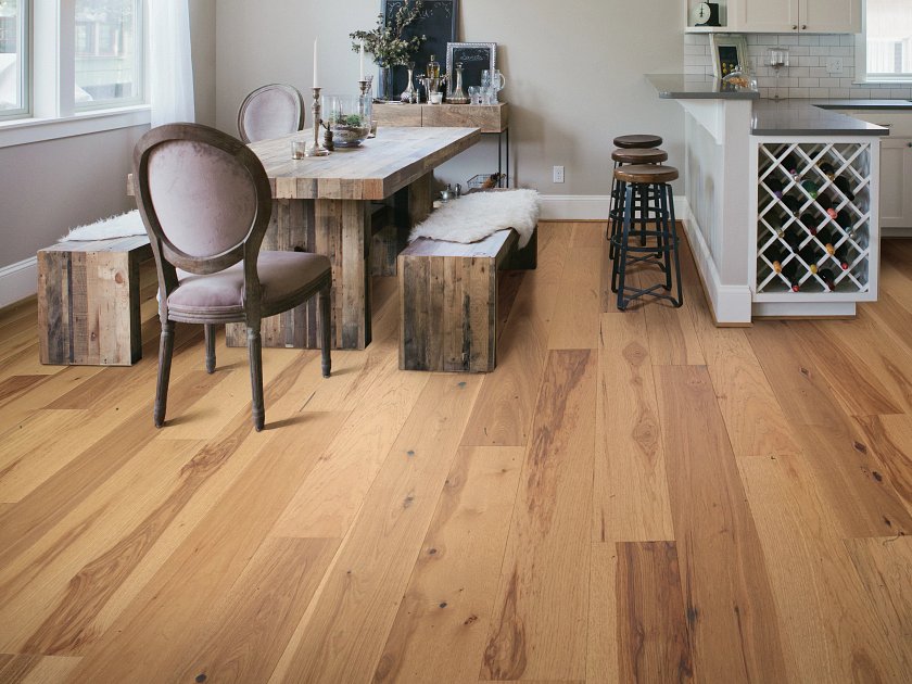 Shaw Sanctuary Hickory Repose engineered hardwood flooring photographed in a living room, pairing natural wood hardwood with sofa seating and the open floor area.