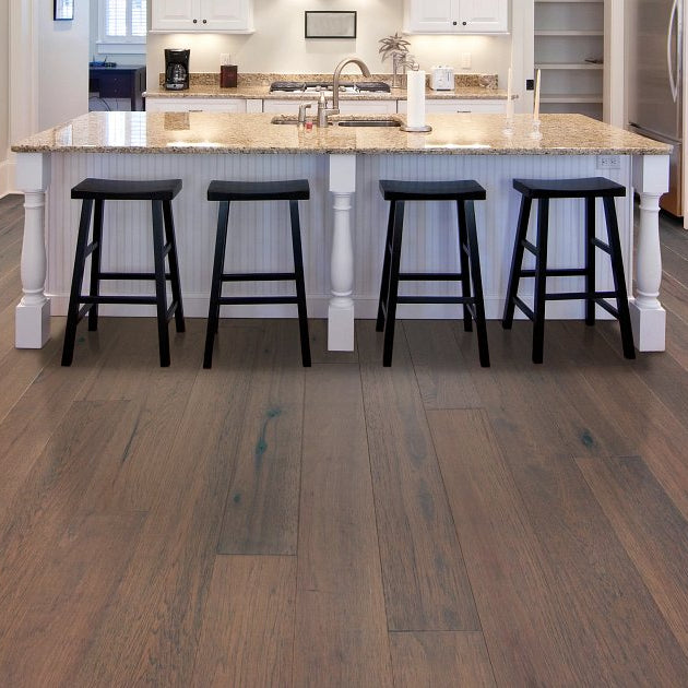 Shaw Sanctuary Hickory Tranquility engineered hardwood flooring in a living room, where natural wood wood tones sit naturally with the furniture layout.