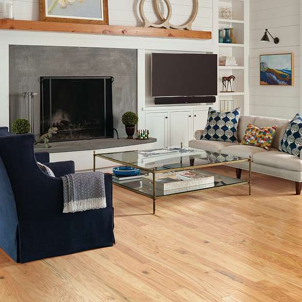 Shaw Albright Oak 3.25 Rustic Natural engineered hardwood flooring photographed in a living room, pairing natural oak hardwood with the furniture layout.