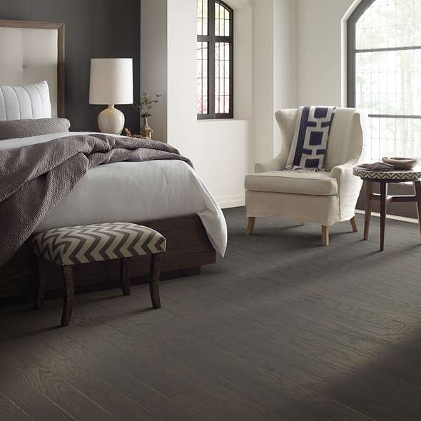 Shaw Albright Oak 3.25 Charcoal engineered hardwood flooring in a living room, with brown color giving the room a soft finished look.