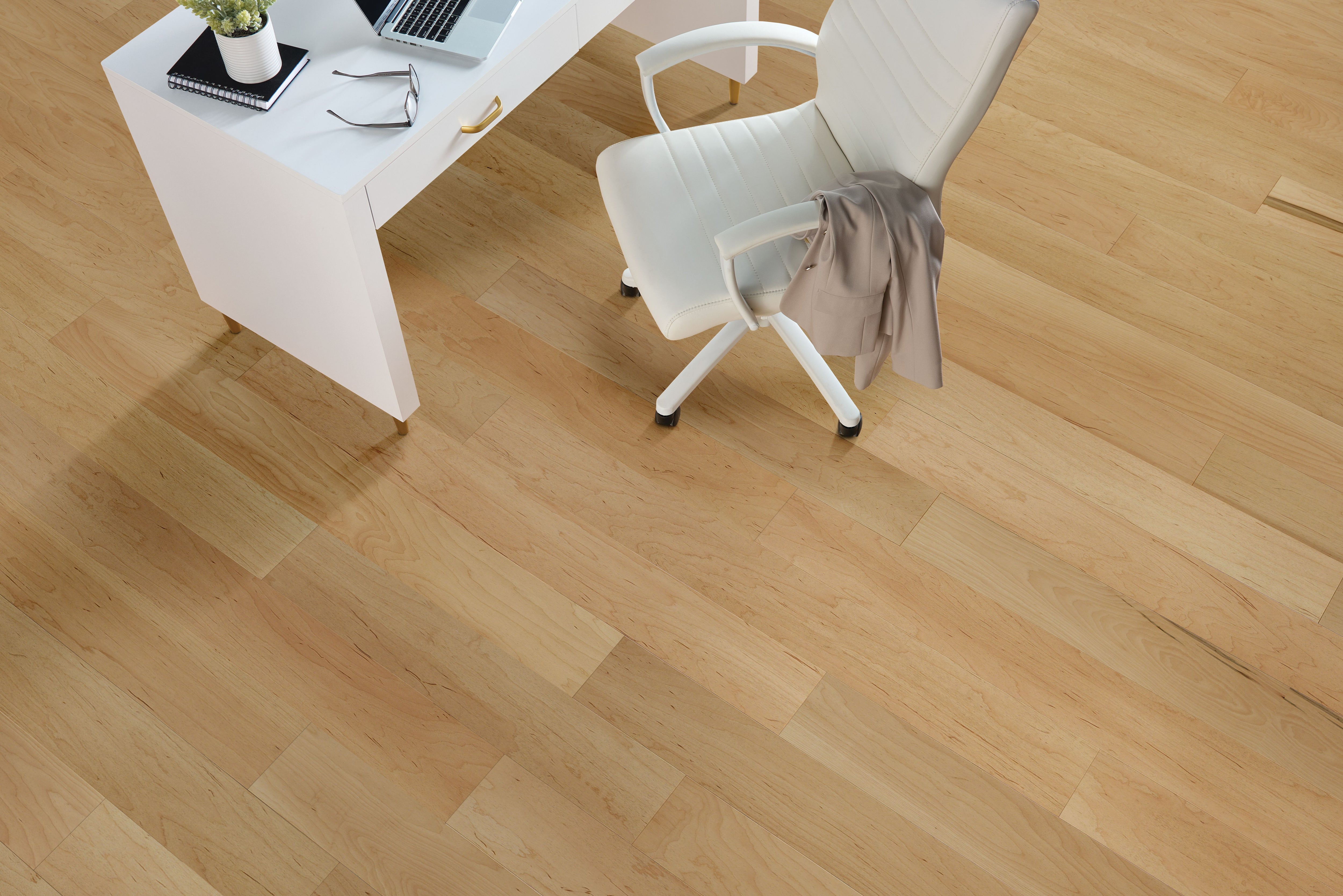 Bright home office with a white desk and chair on pale Ever Natural planks from Armstrong TimberTones LM22M-233W.