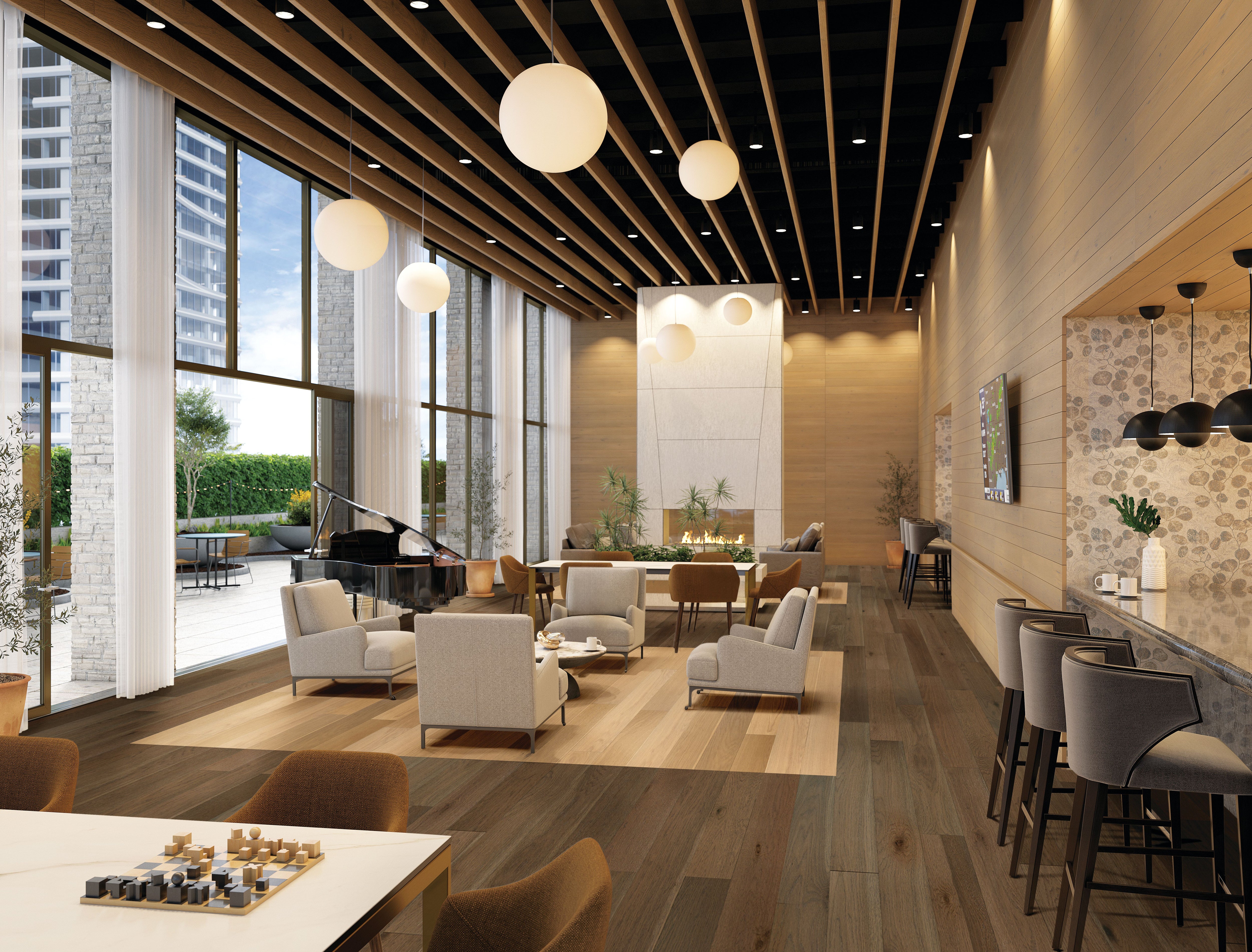 Open hotel lounge with a piano, fireplace and dark Forest Whisper planks framing a pale floor inset from Armstrong hardwood EK7CP443W