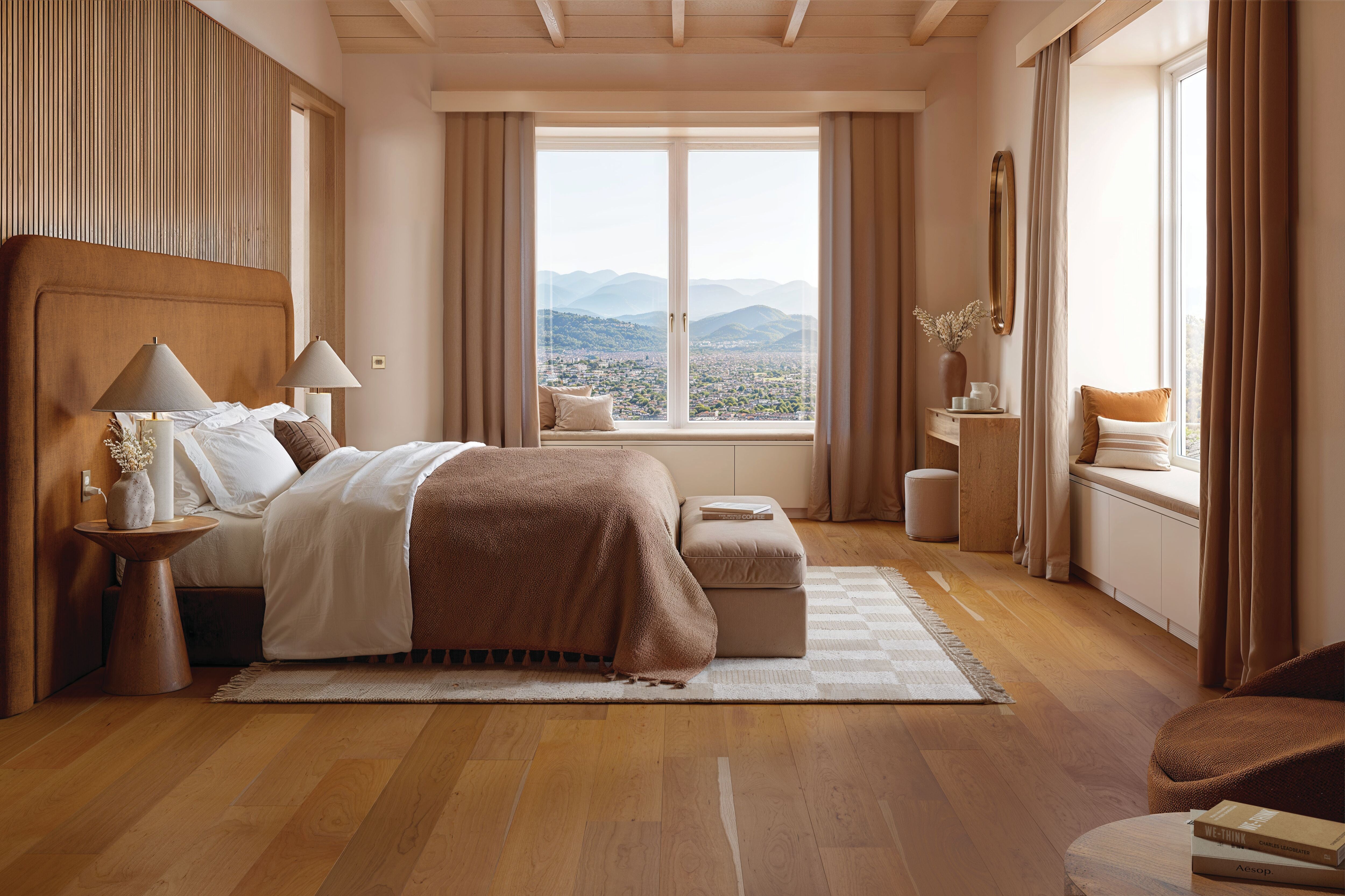 Warm bedroom with mountain views and Heritage Natural wood planks from Armstrong flooring SKU LM19C-466W.