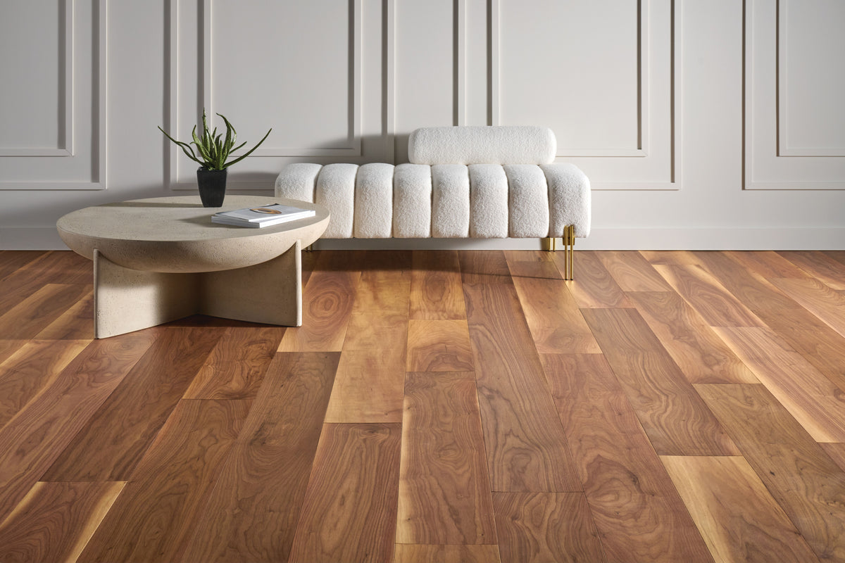 Minimalist living room with a white sofa over richly varied Majestic Natural planks from Armstrong flooring, SKU LM19W-806W.