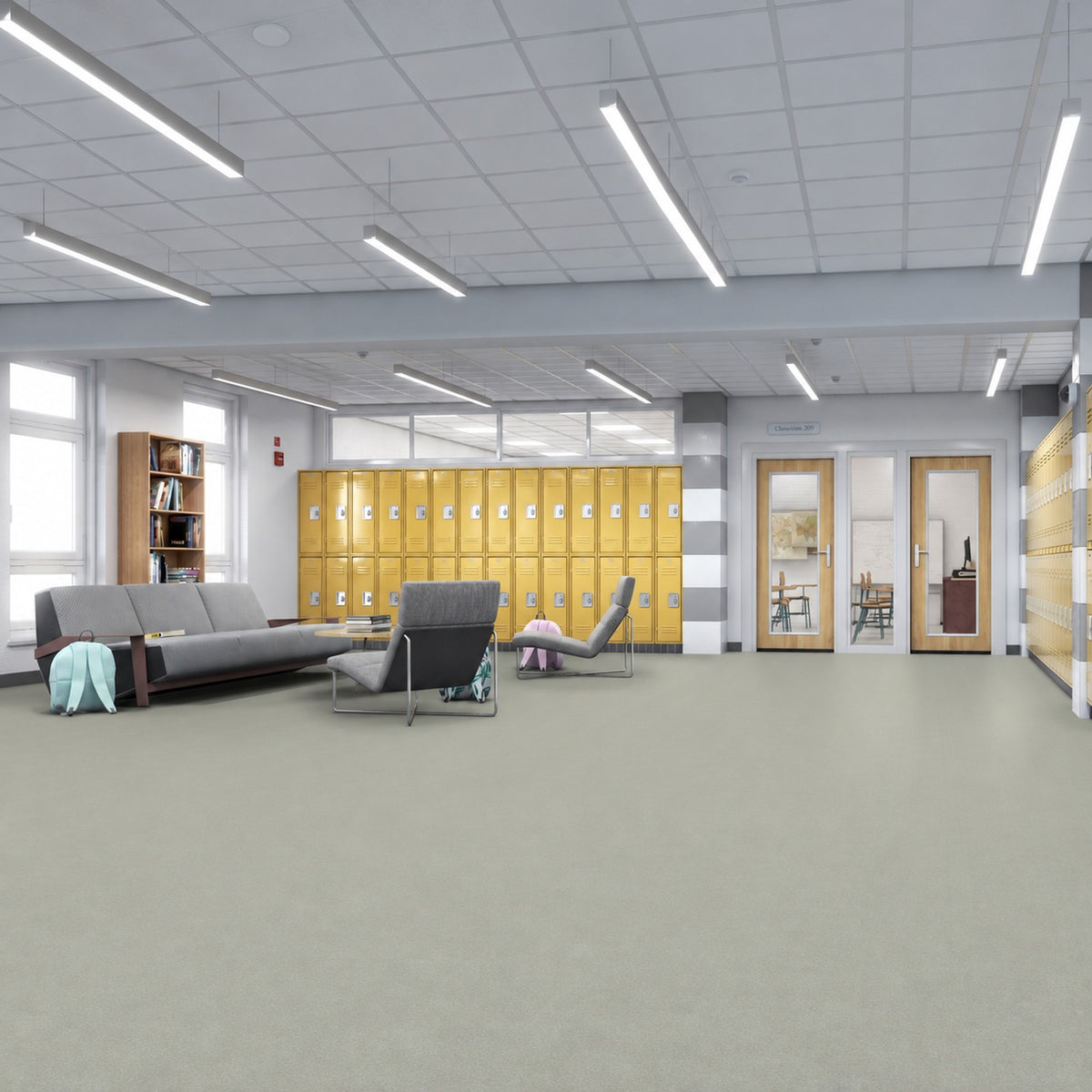 Armstrong Medintone Cocomilk sheet vinyl, a pale greige, in a school commons with yellow lockers, gray lounge seating and classroom doors.