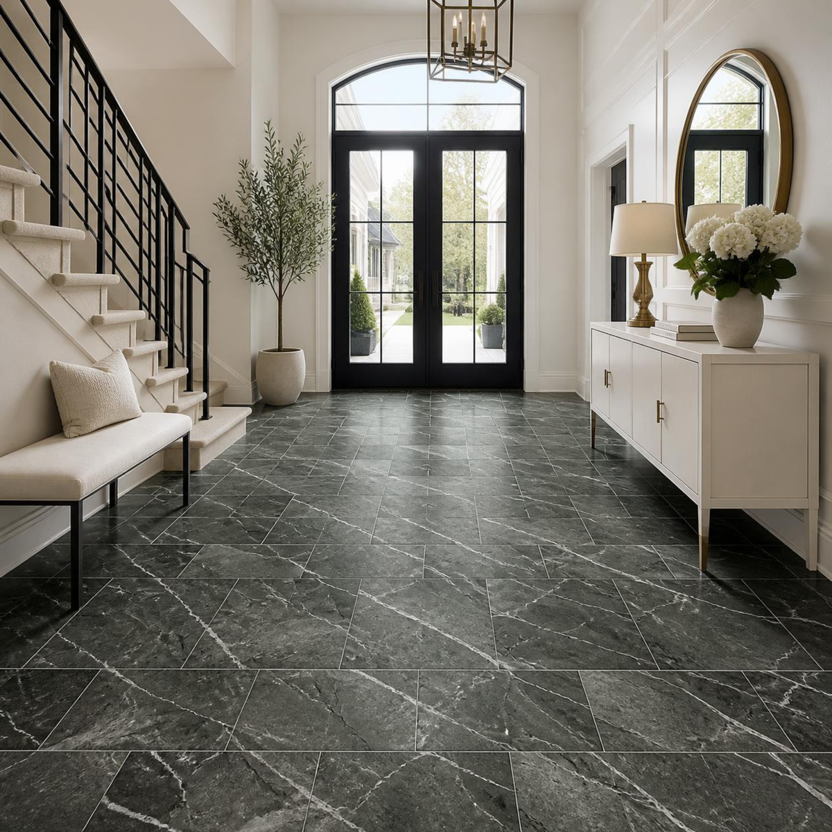 Entry foyer with glass-and-steel double doors, a floating staircase and a white console with round mirror over Armstrong Alterna Nightfall D7384 12x24 vinyl tile flooring.