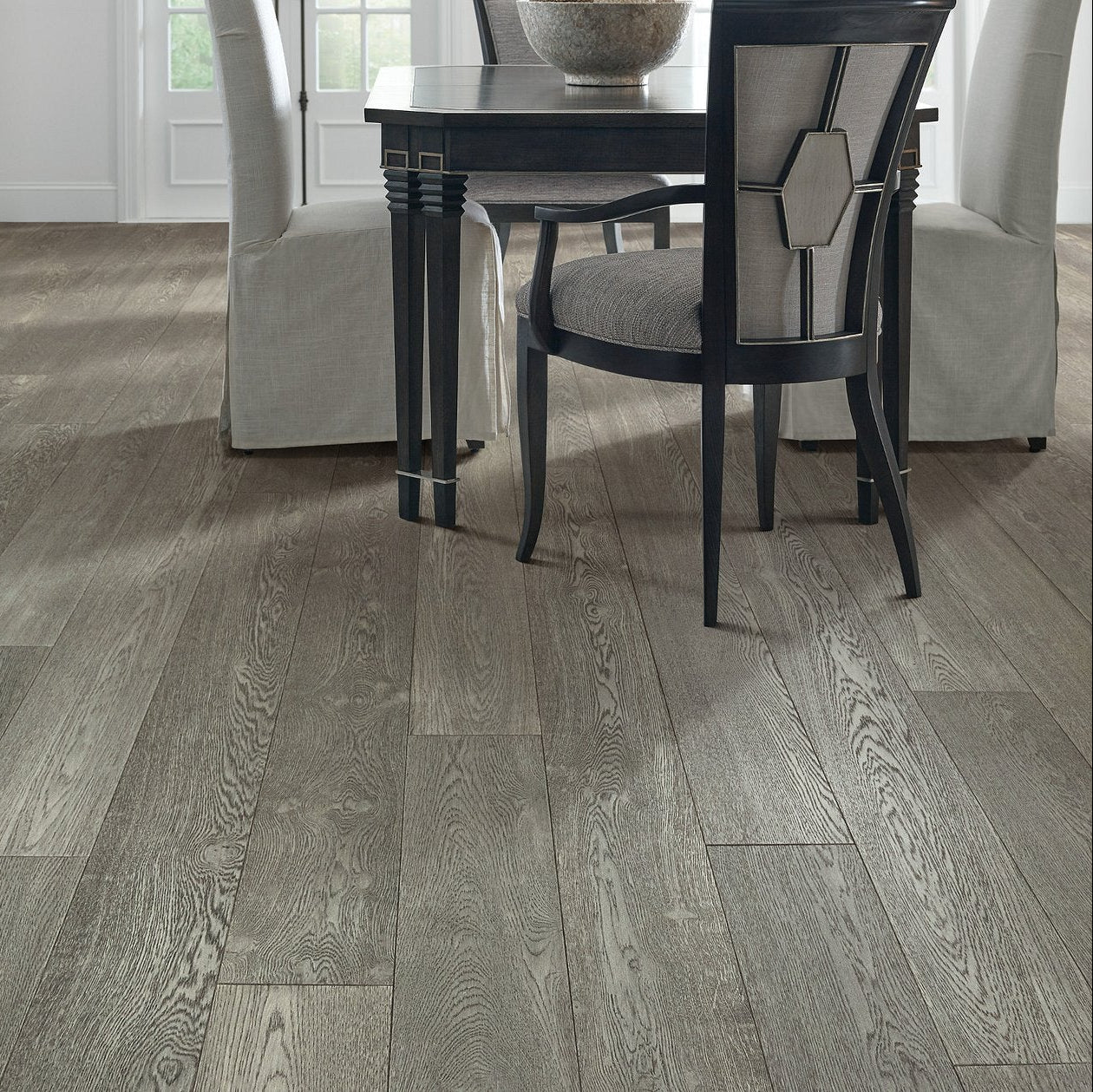 Living room room view with Shaw Couture Oak Chateau engineered hardwood flooring in a natural wood hardwood finish.
