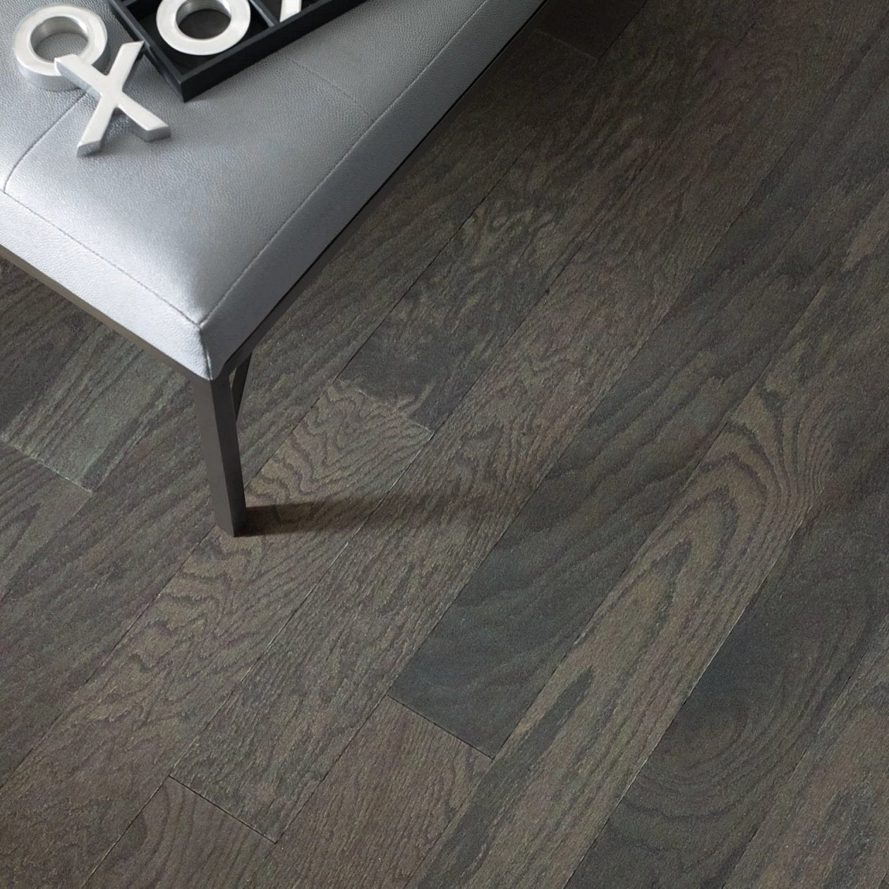 Living room view of Shaw Eclectic Oak Urban engineered hardwood flooring, showing natural wood hardwood color near sofa seating and the open floor area.