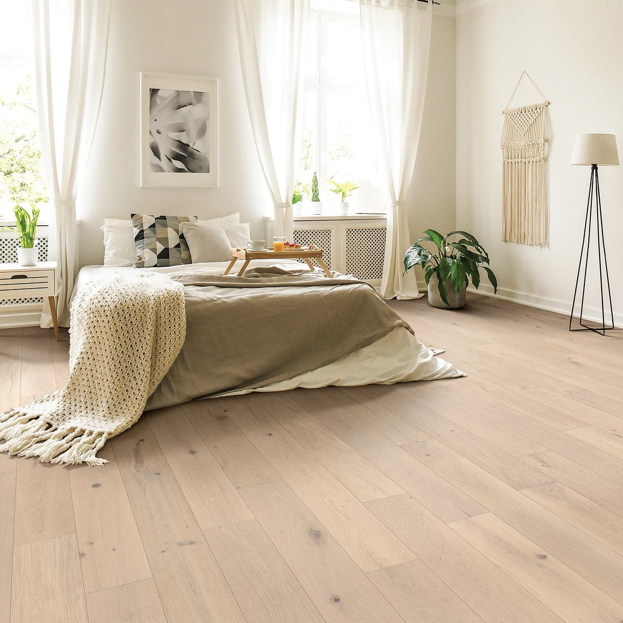 Shaw Expressions Cadence engineered hardwood flooring gives this bedroom a calm look, with light natural color around the bed and nightstand styling.