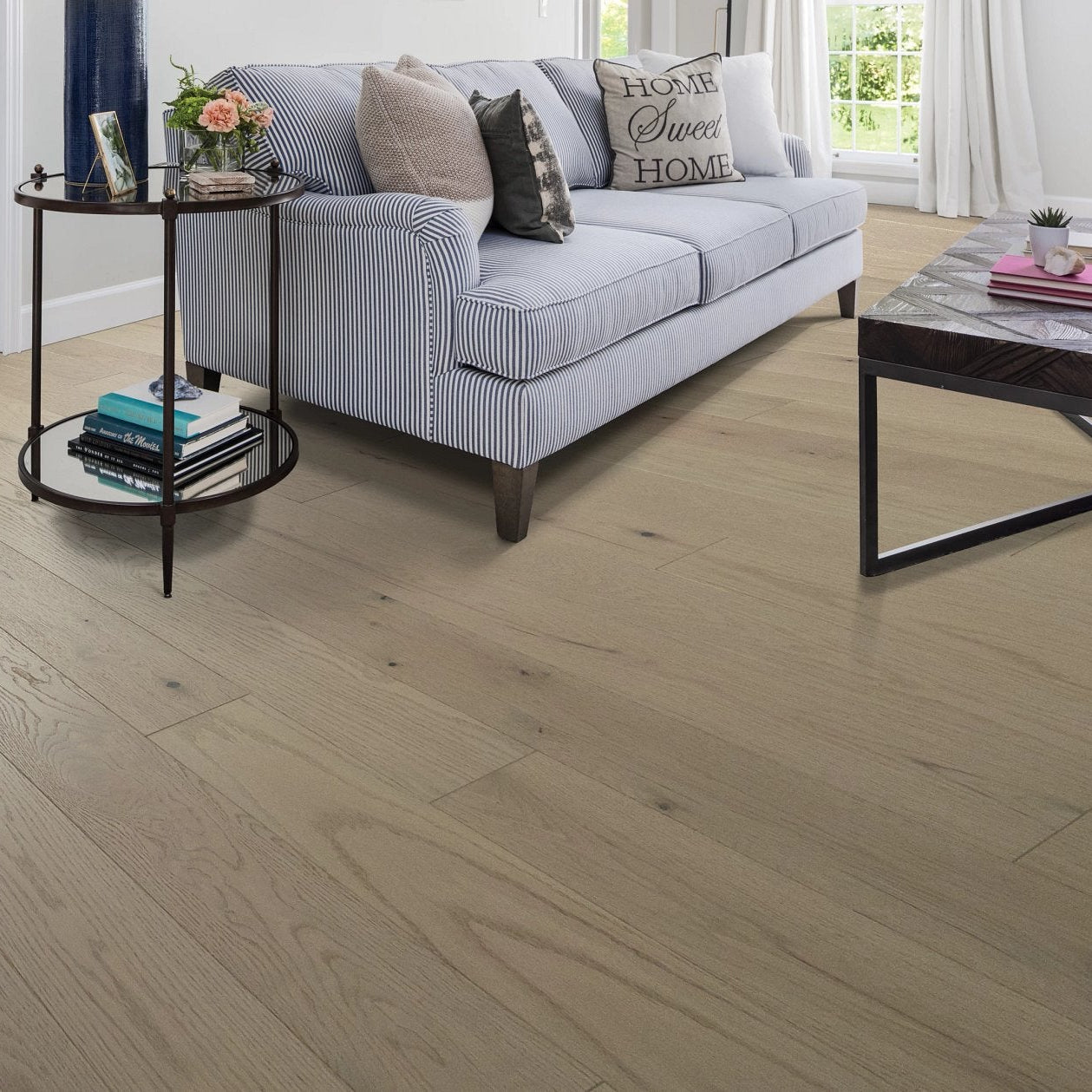 Shaw Sanctuary Oak Haven engineered hardwood flooring in a living room, where natural wood wood tones sit naturally with sofa seating and the open floor area.