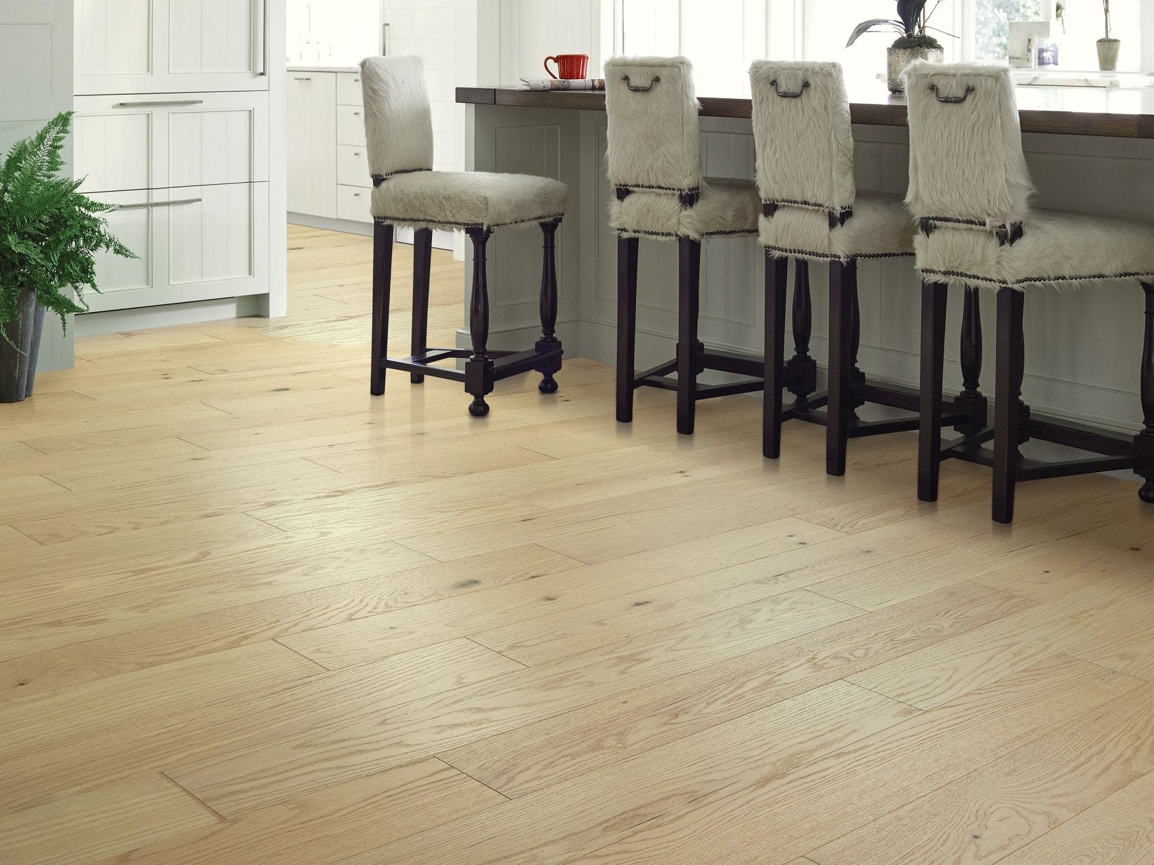 Shaw Sanctuary Oak Fireside engineered hardwood flooring in a dining area, with natural wood color giving the room a welcoming finished look.