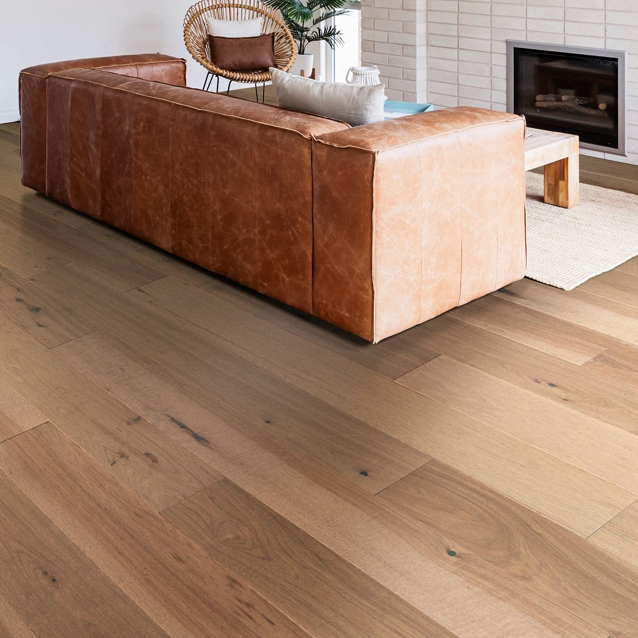 Shaw Exploration Hickory Inlet engineered hardwood flooring photographed in a dining area, pairing natural wood hardwood with the furniture layout.