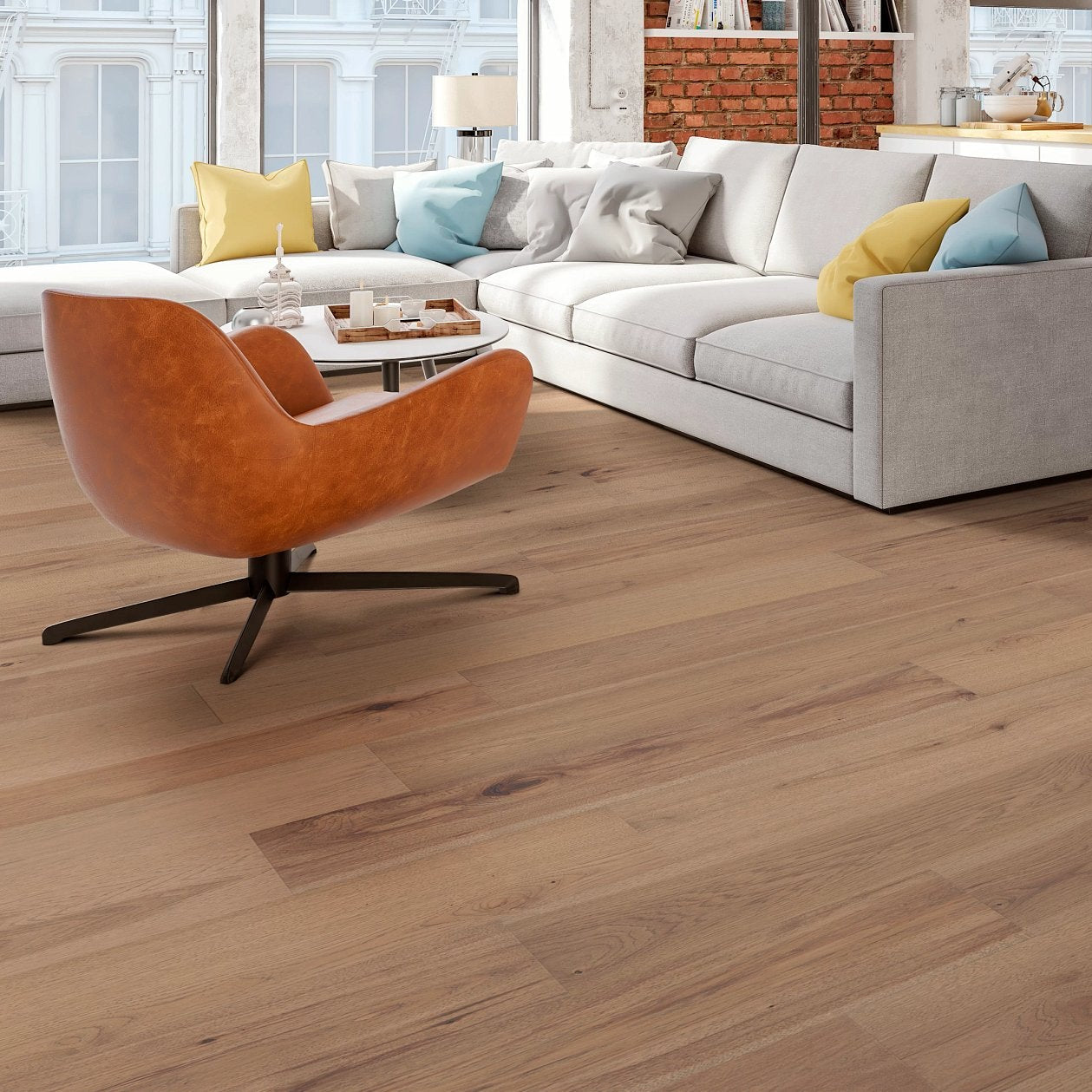 Living room view of Shaw Landmark Sliced Hickory Cumberland engineered hardwood flooring, showing natural wood hardwood color near sofa seating and the open floor area.