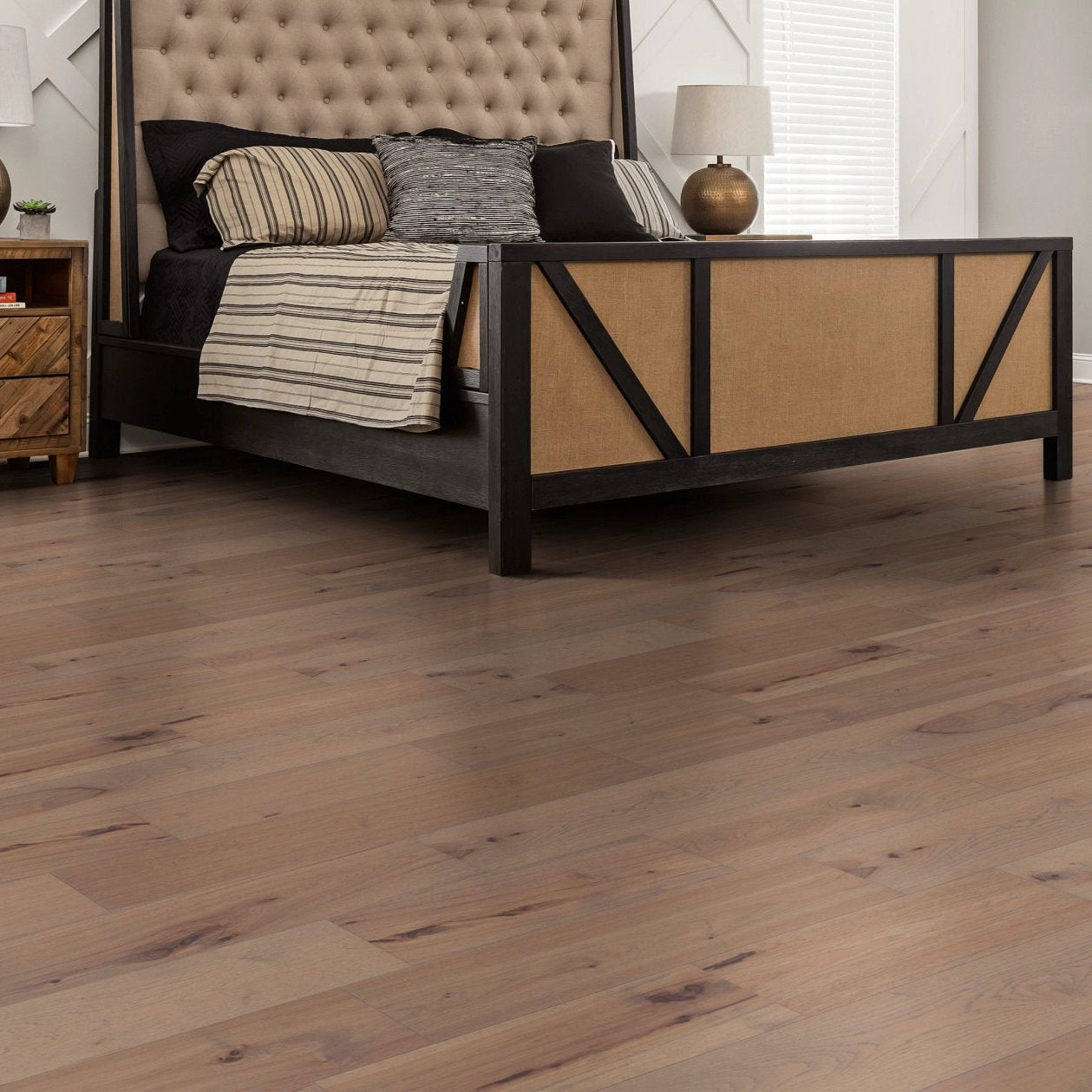 Shaw Landmark Sliced Hickory Crater Lake engineered hardwood flooring shapes this bedroom with natural wood color around the bed and nightstand styling.