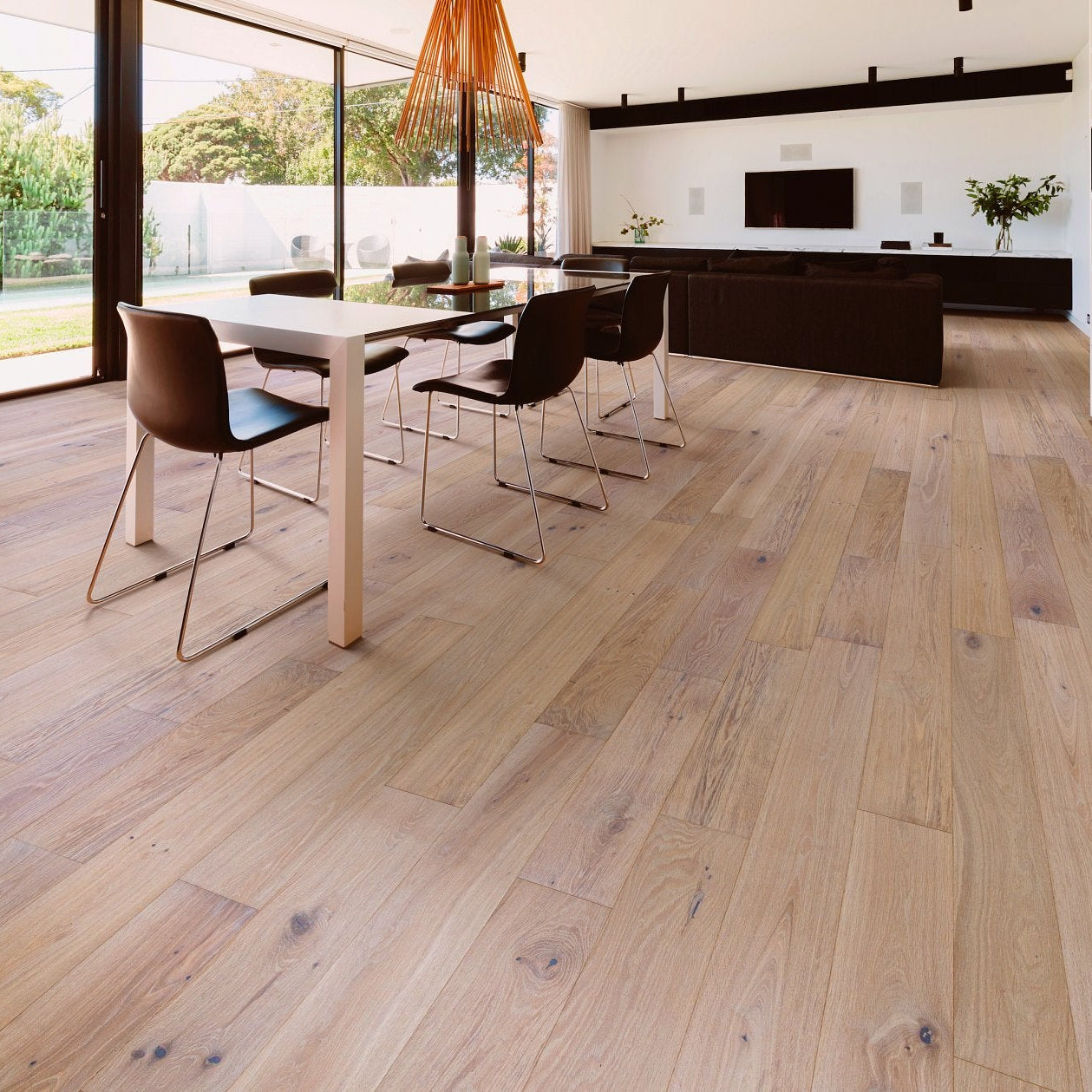 Shaw Ensemble Applique engineered hardwood flooring shapes this living room with natural wood color around the furniture layout.