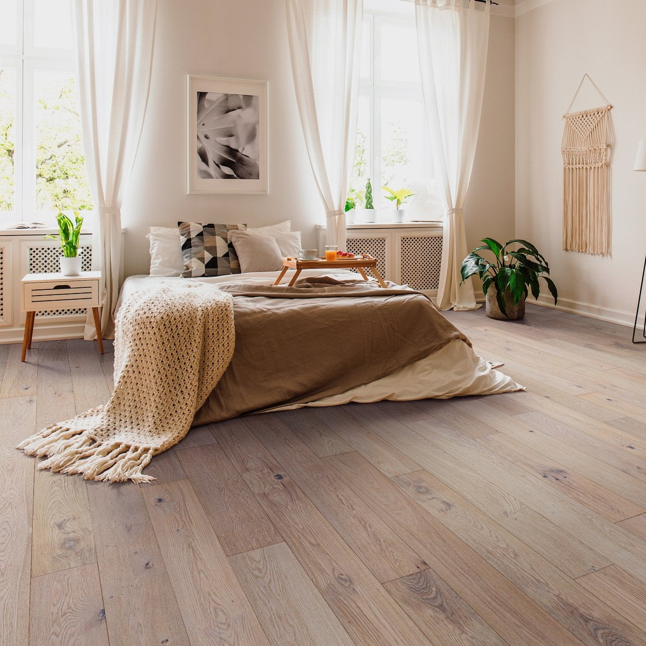 Shaw Ensemble Atelier engineered hardwood flooring in a living room, where natural wood wood tones sit naturally with sofa seating and the open floor area.