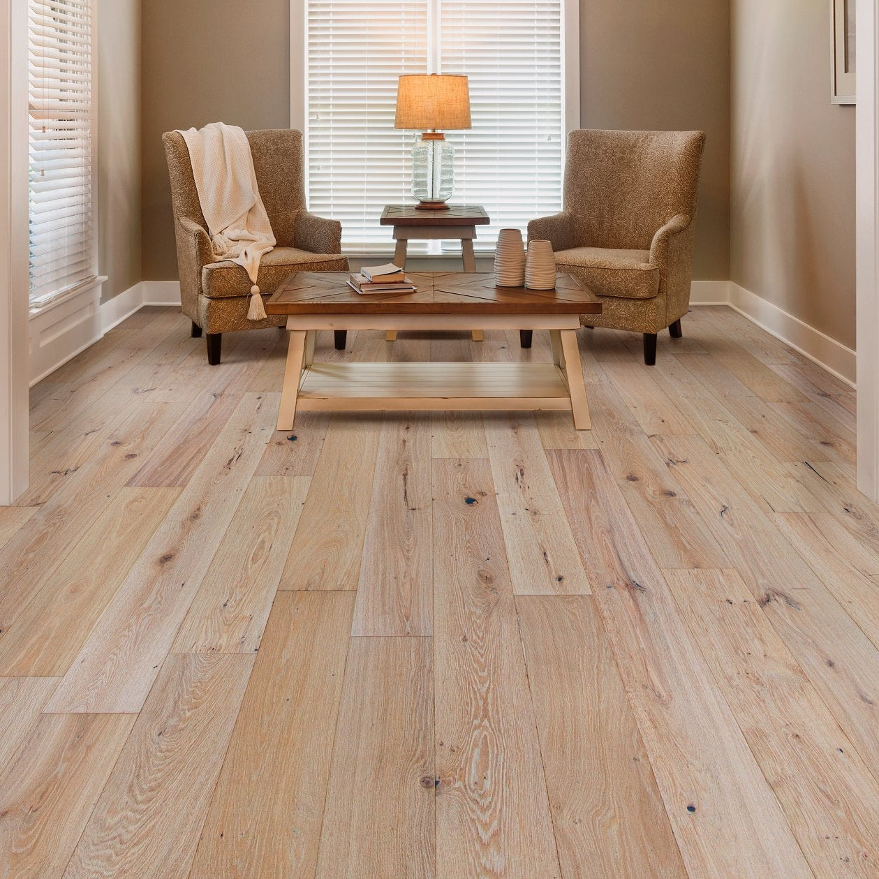 Shaw Ensemble Brocade engineered hardwood flooring shapes this living room with natural wood color around the furniture layout.
