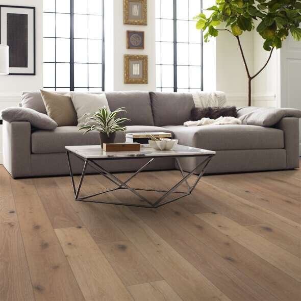 Shaw Castlewood Oak Tapestry engineered hardwood flooring in a living room, with natural wood color giving the room a soft finished look.