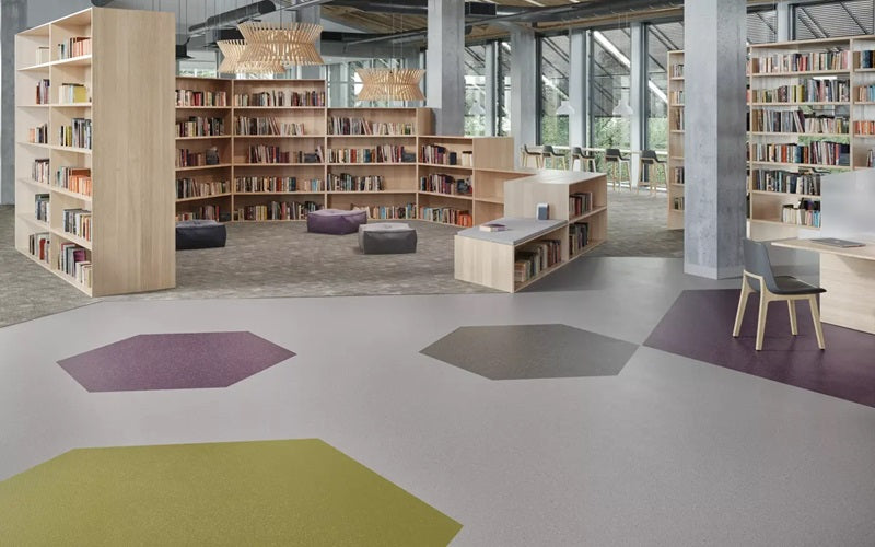 library with hexagon accents in grey flooring design