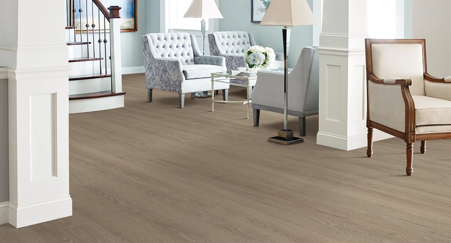 Living room with light brown Willow Oak vinyl flooring and natural light highlighting its wood texture.