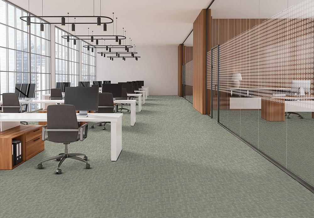  Bright modern office space with Pentz hyperlink green carpet and expansive windows, creating a fresh and inviting atmosphere.