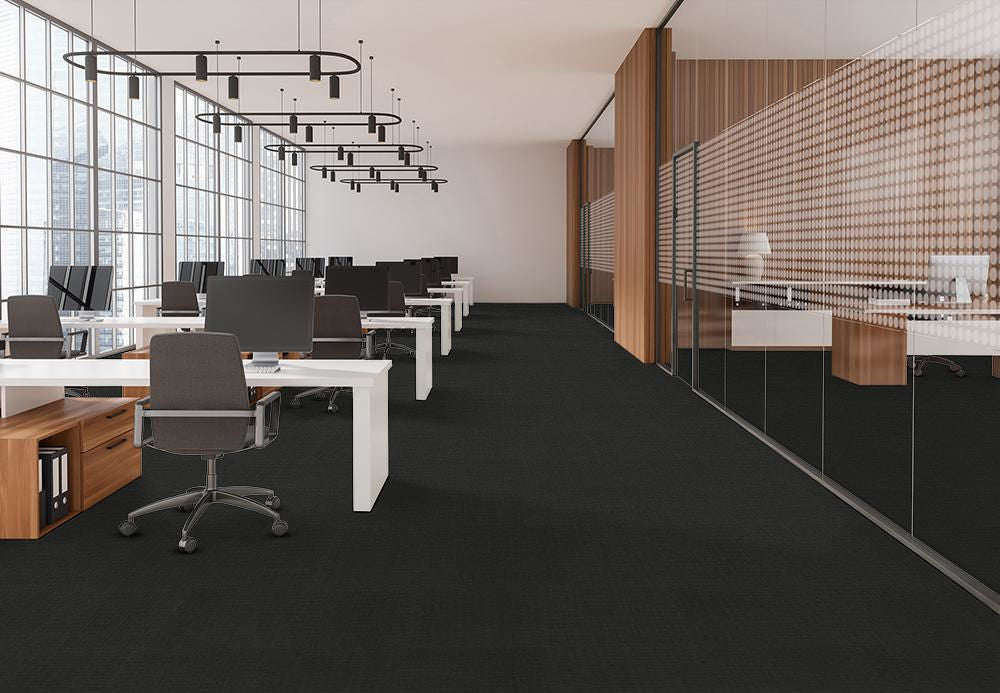Modern office space with black Pentz walk-off carpet and white desks, creating a chic and inviting work environment.