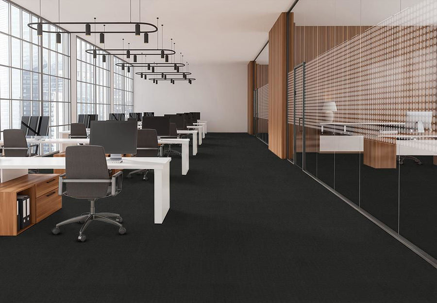 Modern office space with black Pentz walk-off carpet and white desks, creating a chic and inviting work environment.