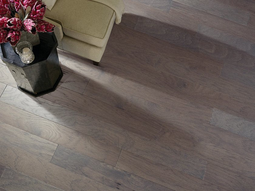 Shaw Northington Smooth Greystone engineered hardwood flooring in a living room, where cool gray wood tones sit naturally with the furniture layout.
