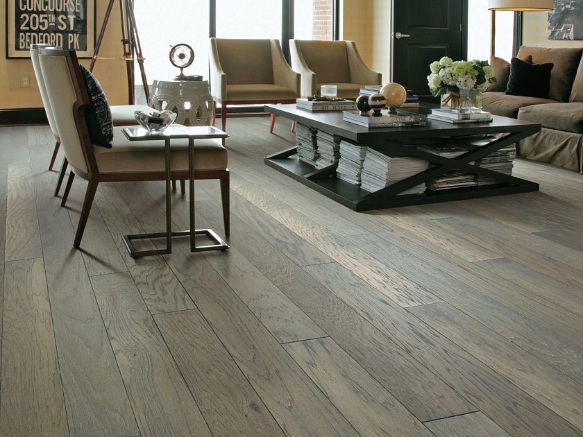 Shaw Northington Brushed Greystone engineered hardwood flooring shown across a living room, highlighting a cool gray hardwood look.
