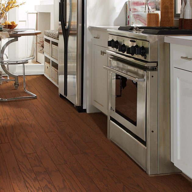 Living room room view with Shaw Albright Oak 3.25 Hazelnut engineered hardwood flooring in a warm hazelnut hardwood finish.