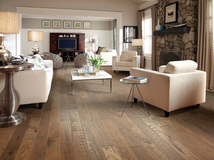 Shaw Pebble Hill Hickory Mixed Width Pacific Crest engineered hardwood flooring in a living room, where natural wood wood tones sit naturally with the furniture layout.