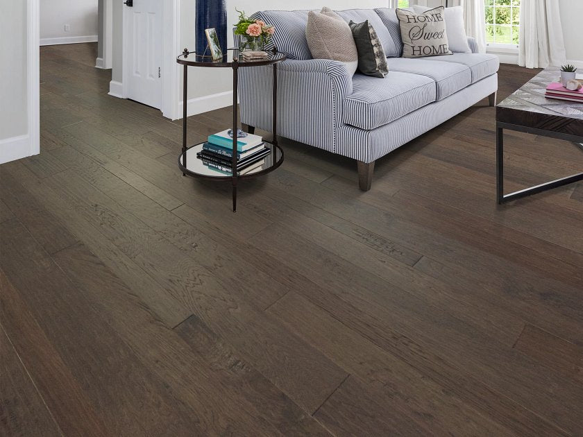 Shaw Pebble Hill Hickory Mixed Width Shearling engineered hardwood flooring in a living room, with room view of color giving the room a welcoming finished look.