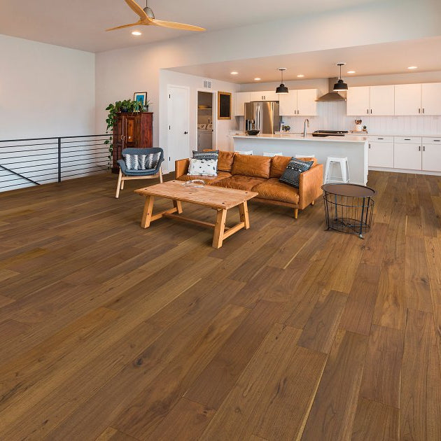 Shaw Regatta Teak 6.5 Maritime engineered hardwood flooring gives this living room a calm look, with natural wood color around sofa seating and the open floor area.