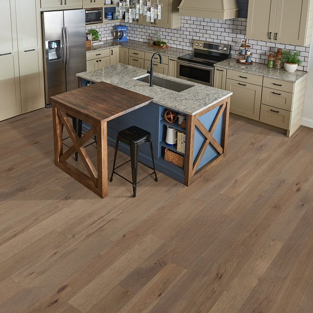 Living room view of Shaw Castlewood Hickory Greyfriar engineered hardwood flooring, showing cool gray hardwood color near the furniture layout.