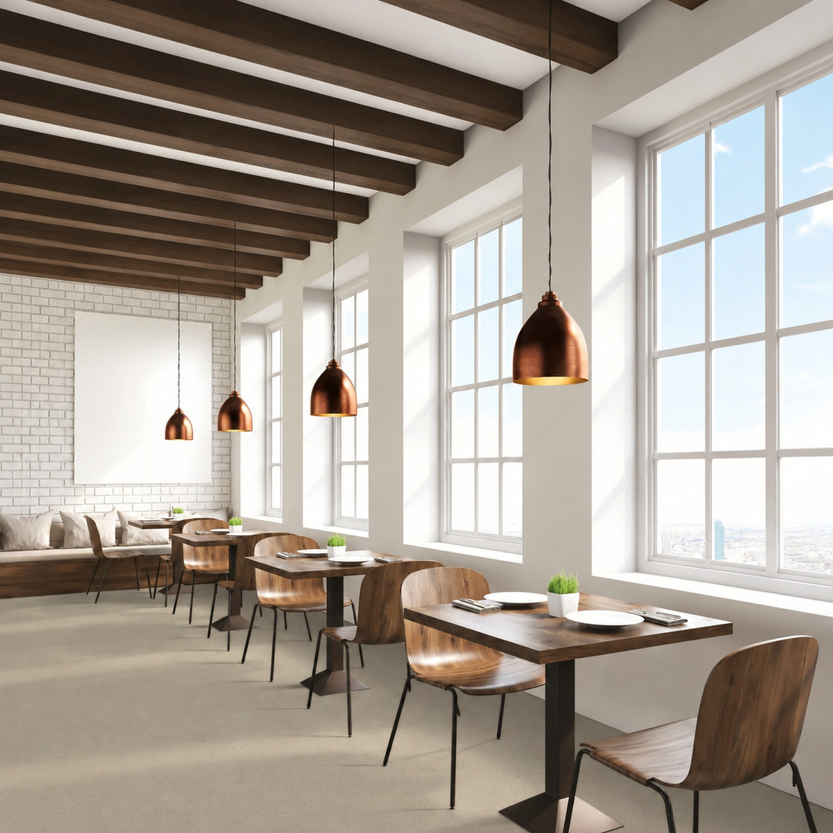 Armstrong Medintone Savannah Balm sheet vinyl, a light sandy beige, in a restaurant dining room with wood tables, copper pendant lights and tall windows.