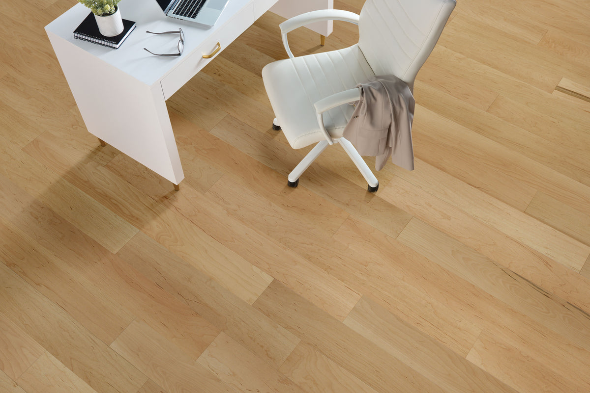 Bright home office with a white desk and chair on pale Ever Natural planks from Armstrong TimberTones LM22M-233W.