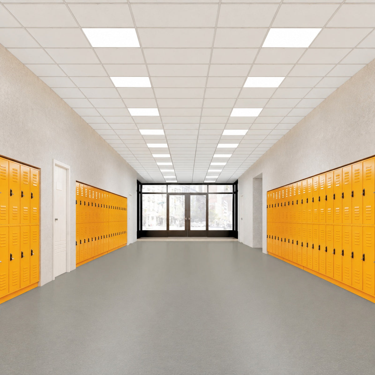 Armstrong Medintone Almond Tea sheet vinyl, a soft warm gray, running the length of a school hallway lined with orange lockers toward glass entry doors.