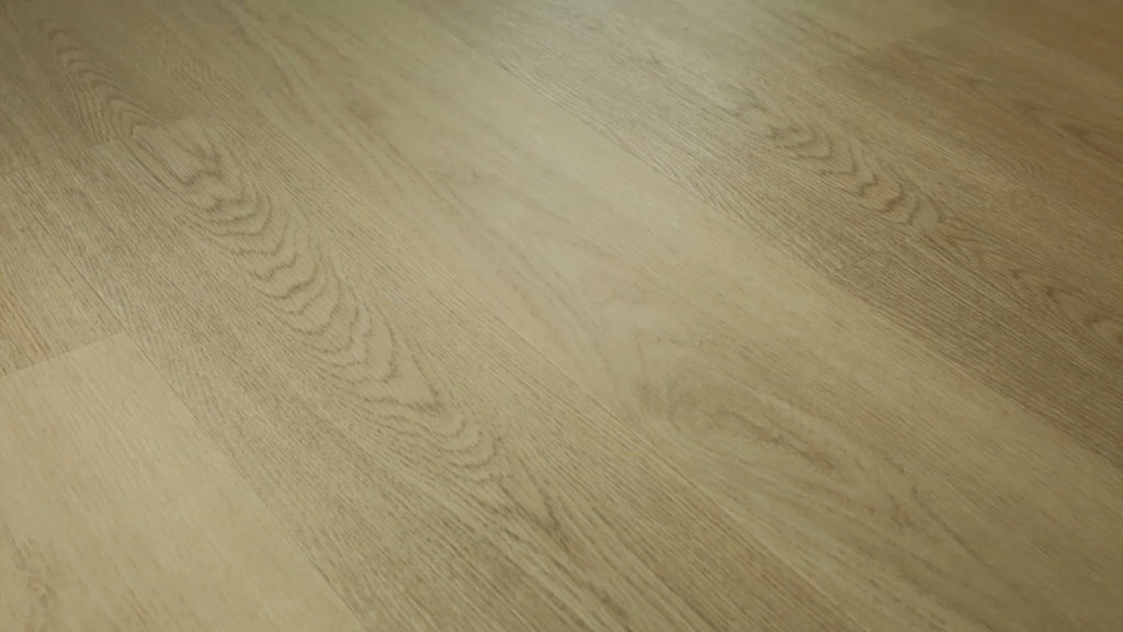 Close-up of installedCOREtec Stockton Oak WPC Vinyl Plank Flooring VV024-05060 LVP Originals Classics 7.13" x 48.03"  in light blonde oak tones, showing detailed wood grain and wide-plank seams.